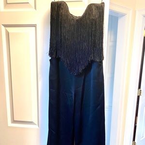 Black fringed jumpsuit. Straight across strapless